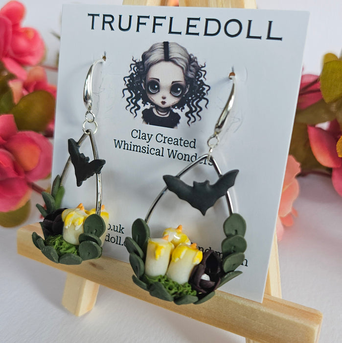 Candles, Bat and Flower