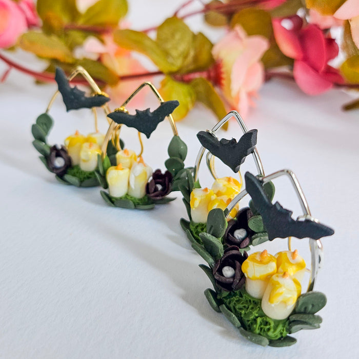 Candles, Bat and Flower